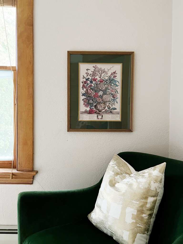 Thrift store floral artwork with green mat and frame