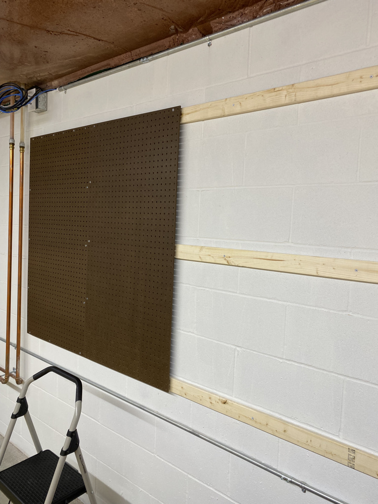 Adding a pegboard to a basement wall