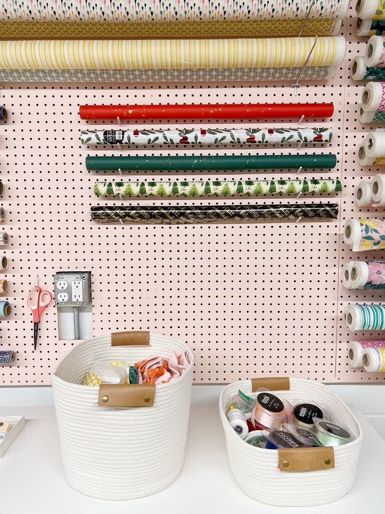 studio pegboard for storing fabric and wrapping paper
