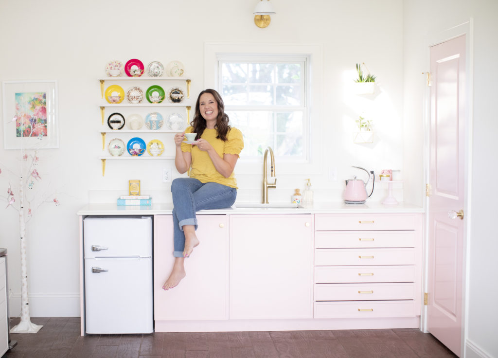Tessie Fay's studio with pink wet bar and teacup shelves